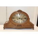 A oak cased mantle clock Postage unavailable