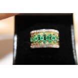A 9ct gold Emerald broad band ring size Q