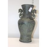 An antique base metal Oriental vase