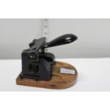 A vintage metal hole punch