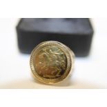 A 9ct gold sovereign ring with full sovereign size T 1/2