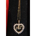 A 9ct gold and Mum pendant 16in long