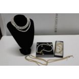 A selection of modern and vintage pearl necklaces