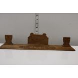A Royal electrical and mechanical engineers wooden stand dated 1947