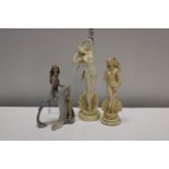 Three assorted lady figurines