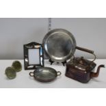 A job lot of assorted metal wares including two brass photo frames from Harrods of London and a