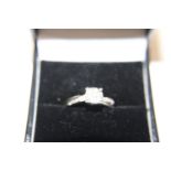 A 9ct white gold diamond cluster ring size J