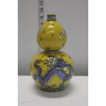 A Oriental gourde shaped yellow ground vase