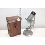A WW2 303 Vickers machine gun belt case dated 1941 and a vintage Olympus inspection lamp