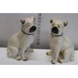 A pair of Victorian ceramic pug dogs (A/F)