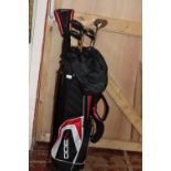 A golf bag with stand and selection of clubs shipping unavailable