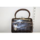 An antique ladies hide purse/bag