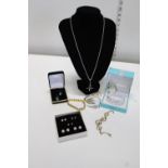 A selection of boxed costume jewellery