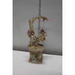A large resin figural mantel clock shipping unavailable