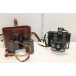 A vintage Polaroid camera & pair of Ozeck binoculars