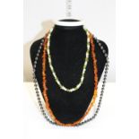 Amber Necklace, Peridot and Pearl necklace and a Haematite necklace and semi precious stone bangle