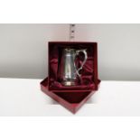 A boxed silver plated tankard