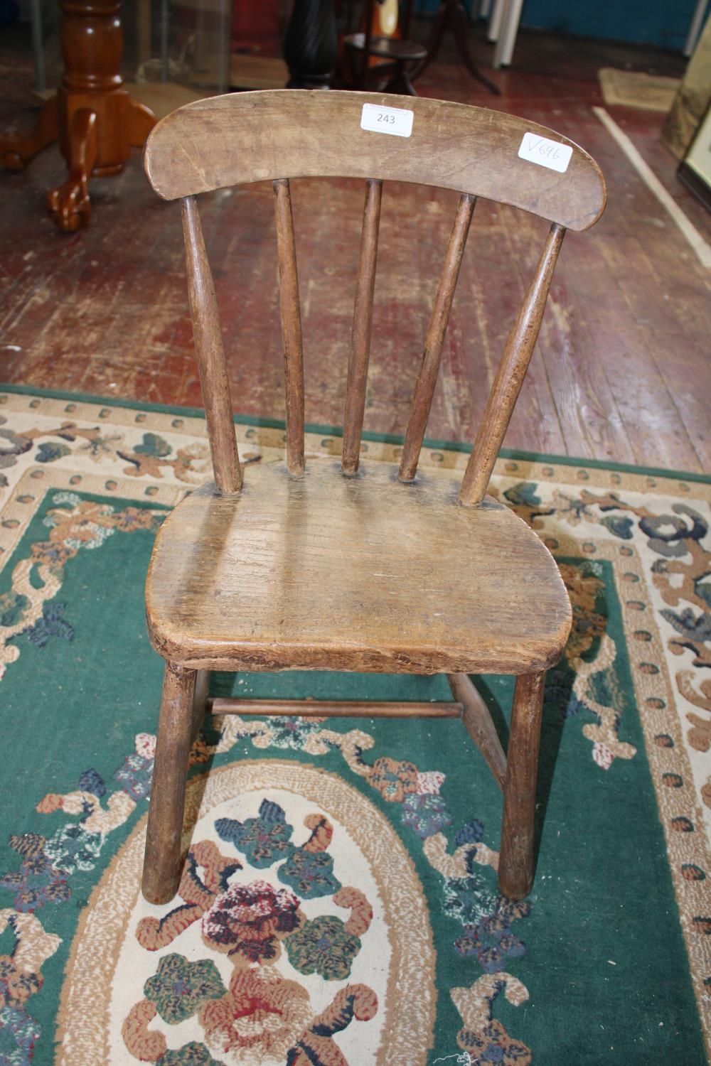 A antique child's elm chair. postage unavailable