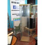 A glass display cabinet with shelves. postage unavailable