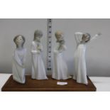 Four Spanish porcelain figures on wooden display stand (one a/f)