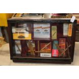 A vintage Cigar display case with contents