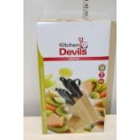 A kitchen devils knife block set