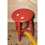 A vintage red painted wooden stool. postage unavailable