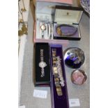 A job lot of assorted ladies watches and paperweights