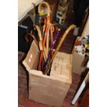 A job lot of assorted walking sticks and canes. postage unavailable