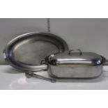 A selection of stainless steel kitchenware including a fish kettle. Postage unavailable