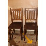 A pair of antique elm chairs. postage unavailable