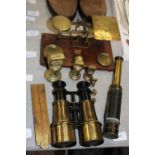 A selection of vintage brassware items including Post Office scales and binoculars