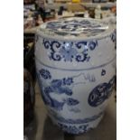 A large Chinese porcelain garden seat with Dragon decoration. postage unavailable
