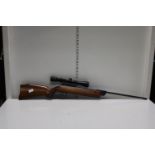 A vintage Diana .22 air rifle with scope. postage unavailable