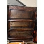 A antique globe Wernicke three tier bookcase with under drawer. Postage unavailable