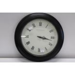 A modern station style battery powered wall clock. Postage unavailable