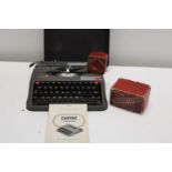 A vintage Empire portable typewriter & other items. Postage unavailable