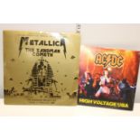 A sealed AC/DC record & Metallica LP