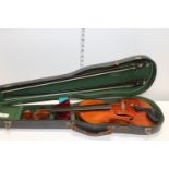 A cased antique Frank Watson of Rochdale violin with makers label dated 1909 23 inches long in