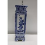 A large tall Chinese blue and white porcelain vase on stand. Postage unavailable