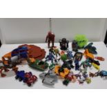 A large selection of assorted vintage figures and toys (Masters of the Universe etc)