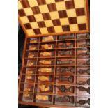 A quality inlaid chess board and wooden chess pieces