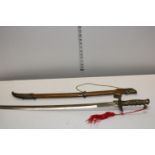 A reproduction sword and scabbard. postage unavailable