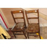 A pair of antique wooden children's chairs. Postage unavailable