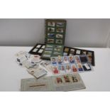 A selection of loose collectors cards and cigarette cards