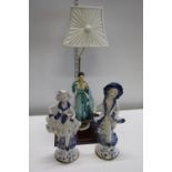 Two vintage Capodimonte figures and a figural table lamp. postage unavailable