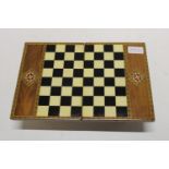 Aa inlaid chess board and pieces which folds into a beautiful box