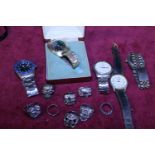 A job lot of assorted watches and dress rings