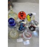 A job lot of assorted glass paperweights including Caithness