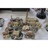 A job lot of cottage and buildings models. postage unavailable